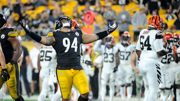 Tyson Alualu celebrating a sack against the Bengals